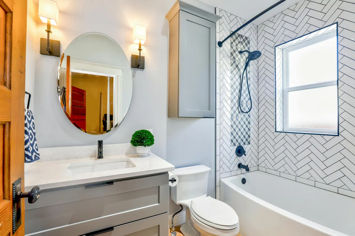 Herringbone tile bathroom renovation - quality craftsmanship by Ridgeline Renovations Calgary